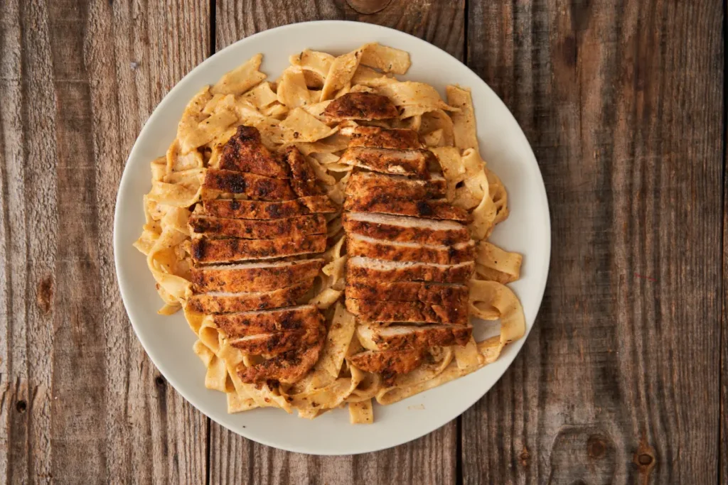 Ingredients for Cajun Chicken Alfredo recipe. Preparing spicy Cajun chicken for Alfredo pasta.