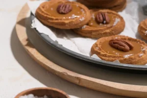 Freshly baked Salted Caramel Cookies on a cooling rack Ingredients for Salted Caramel Chocolate Chip Cookies recipe