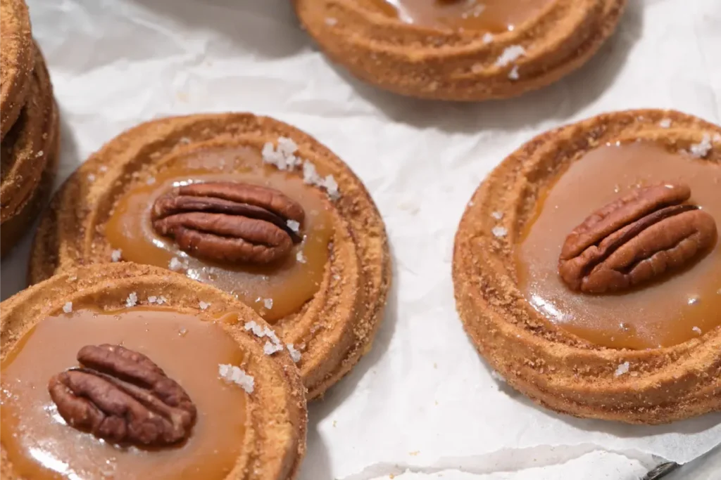 Close-up of Sweet and Salty Cookies showing gooey caramel center Essential baking tools for making Caramel Stuffed Cookies