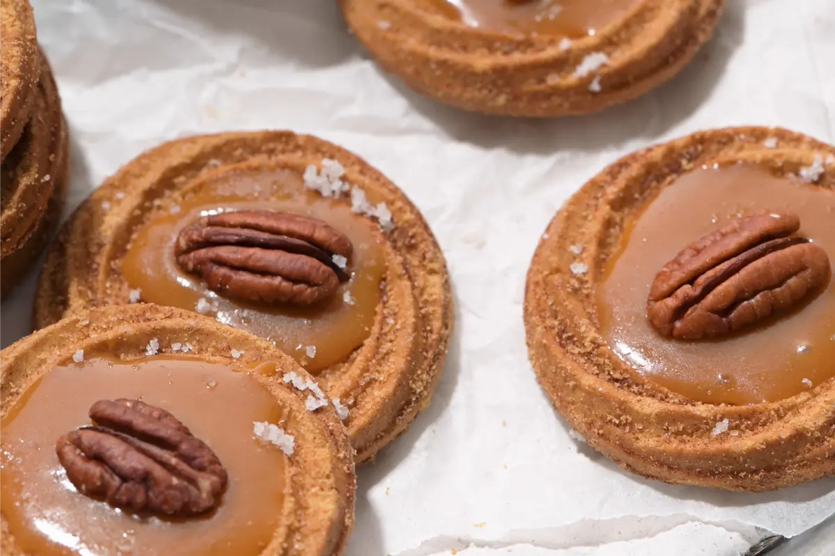 Close-up of Sweet and Salty Cookies showing gooey caramel center Essential baking tools for making Caramel Stuffed Cookies