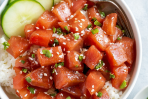 Assembling the Seared Ahi Salad with vibrant vegetables.