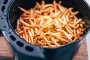 Golden crispy frozen fries served with dipping sauce