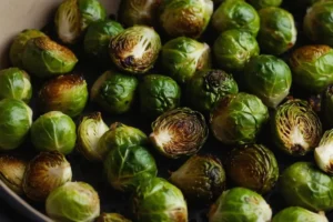 Healthy Brussels sprouts sides served with grilled chicken.