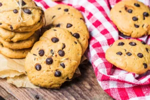 "Ingredients for homemade Caramel Chocolate Chunk Cookies." "Serving Salted Caramel Chocolate Cookies with milk."